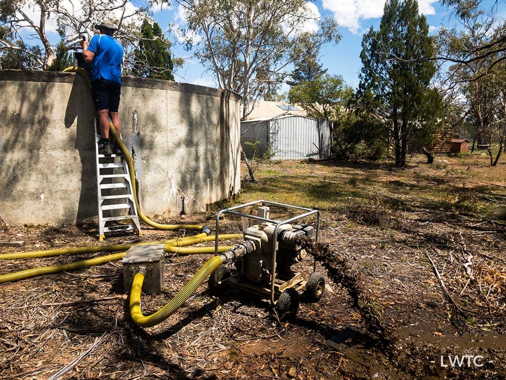 This image shows a dirty water tank being cleaned.