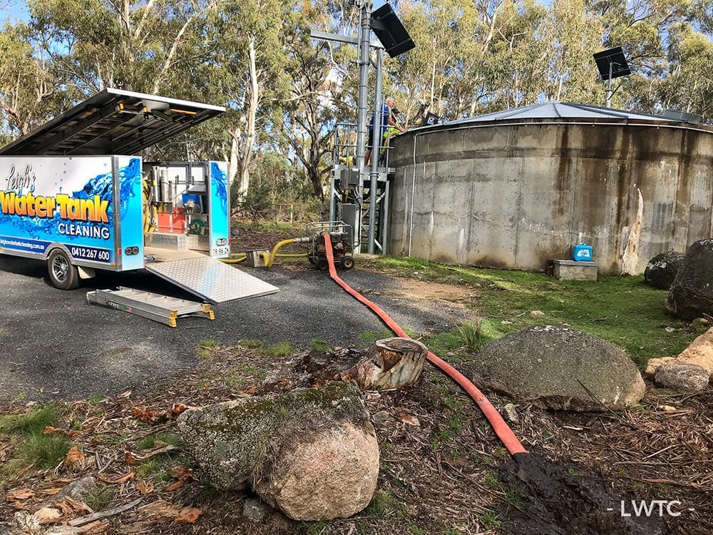 This image shows a water tank being cleaned at Sawpit Creek in the Kosciuszko National Park.