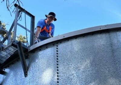 Leigh harnessed on top of tank